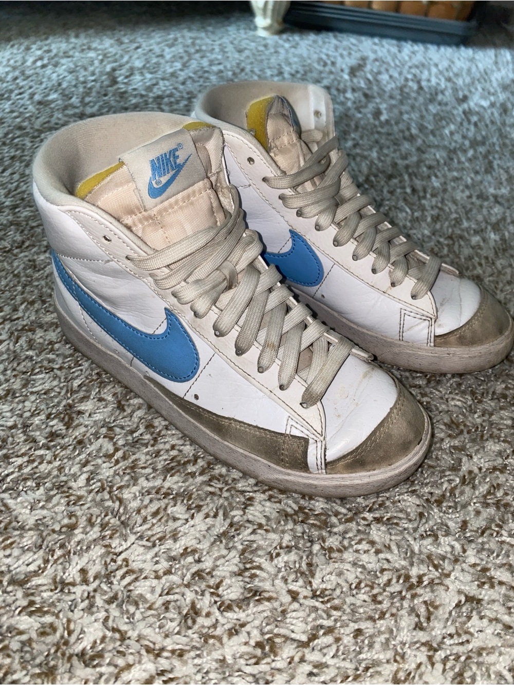 Nike White High-Top Sneakers with Blue Swoosh